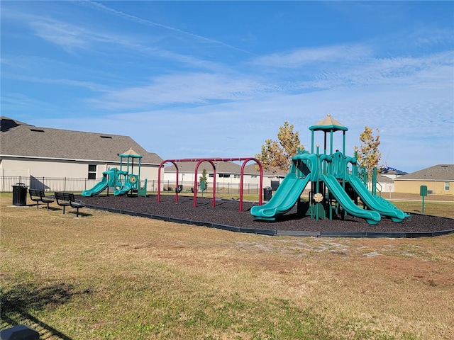 view of playground with a lawn