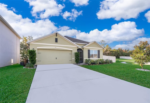 ranch-style house featuring a garage and a front yard