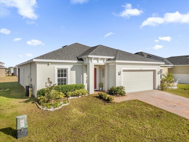 view of front facade with a front lawn and a garage