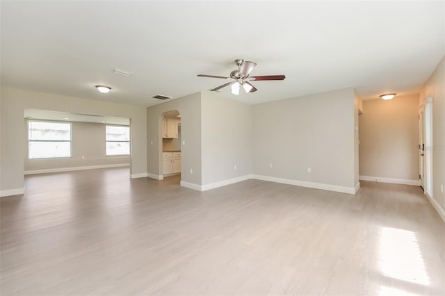 unfurnished room featuring ceiling fan and light hardwood / wood-style floors