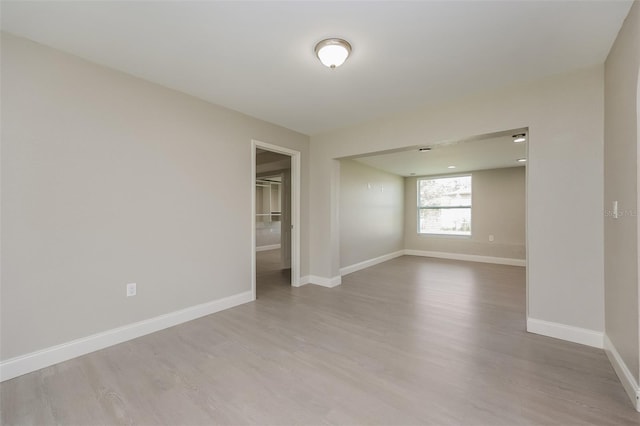 unfurnished room featuring hardwood / wood-style floors