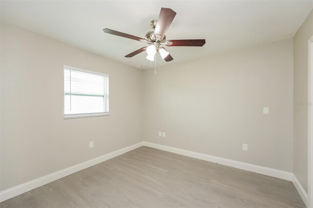 spare room featuring ceiling fan and light wood-type flooring