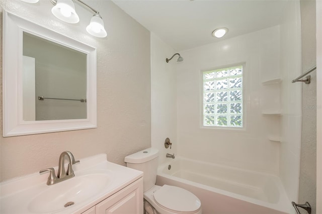 full bathroom featuring bathing tub / shower combination, vanity, and toilet