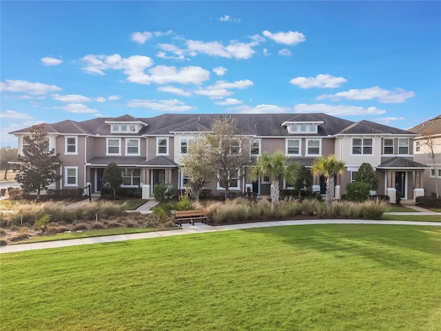 view of property's community with a lawn