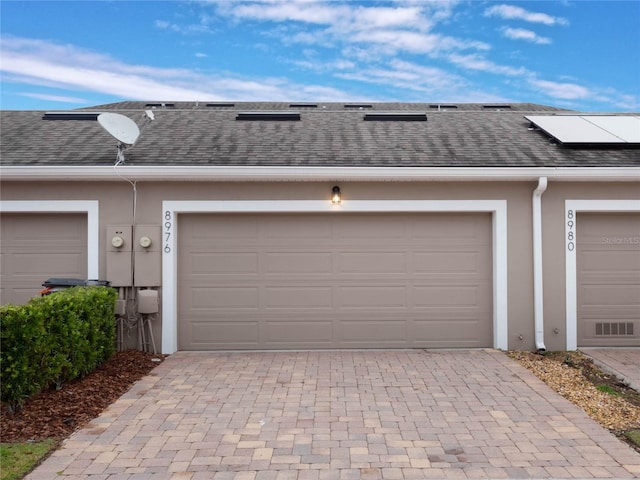 garage featuring solar panels