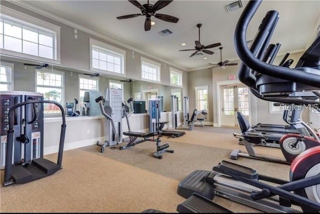 exercise room featuring crown molding, carpet flooring, ceiling fan, and french doors