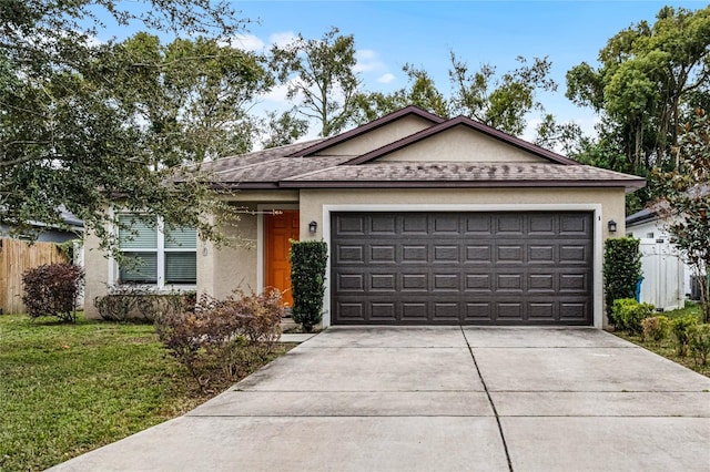 ranch-style home featuring a garage and a front yard