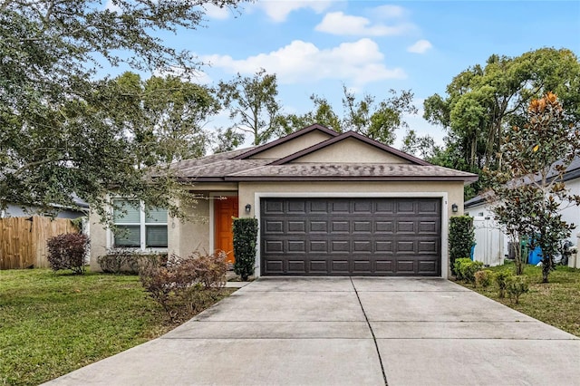 single story home with a front lawn and a garage