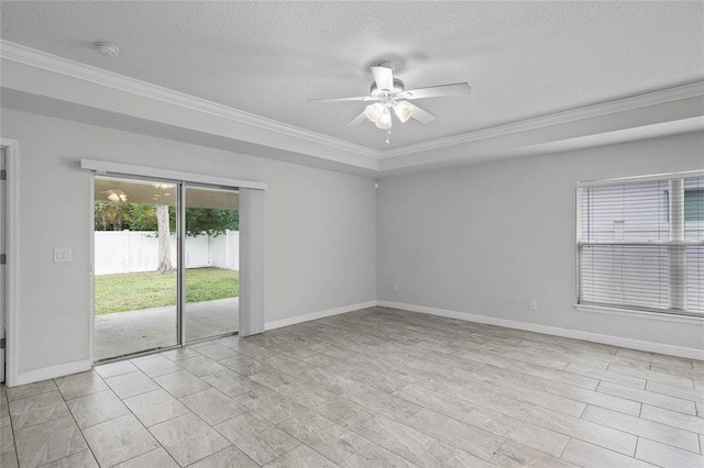 unfurnished room with ceiling fan, a textured ceiling, and ornamental molding