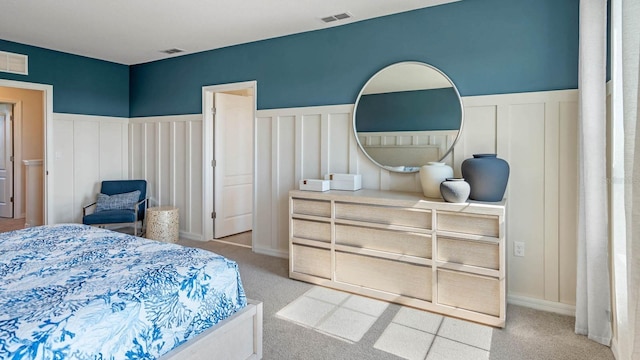 bedroom featuring light colored carpet