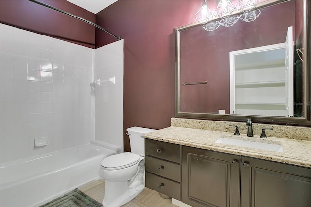 full bathroom featuring shower / bathing tub combination, vanity, and toilet