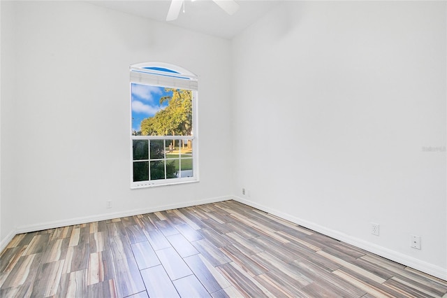 spare room featuring ceiling fan and wood-type flooring