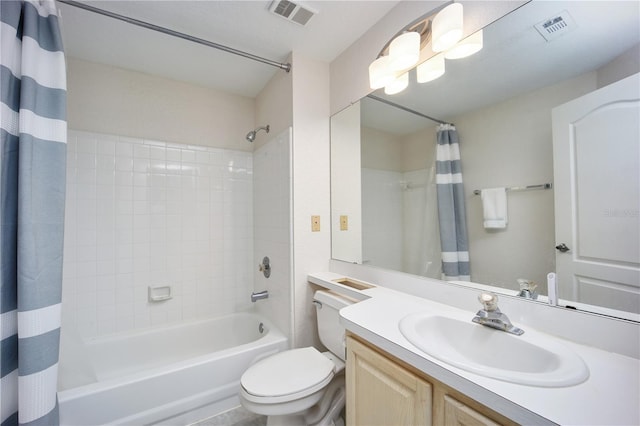 full bathroom featuring shower / tub combo with curtain, vanity, and toilet