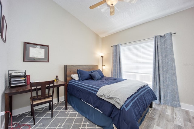 bedroom featuring wood-type flooring, ceiling fan, and lofted ceiling