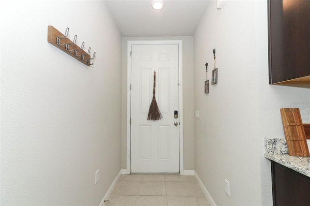 entryway featuring light tile patterned floors