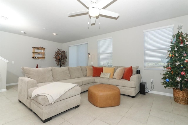 tiled living room featuring ceiling fan