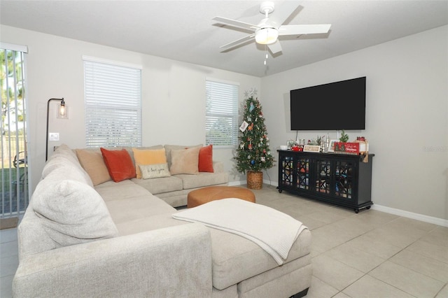 tiled living room with ceiling fan