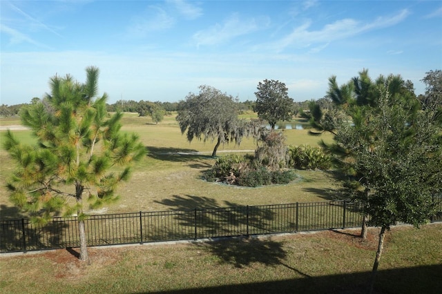 view of yard with a rural view and a water view