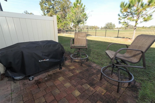 view of patio with a grill