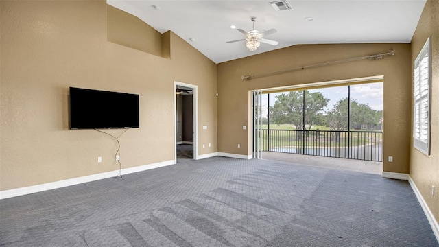 unfurnished living room with carpet floors, vaulted ceiling, and plenty of natural light