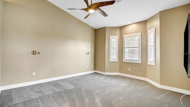 carpeted empty room with ceiling fan and lofted ceiling