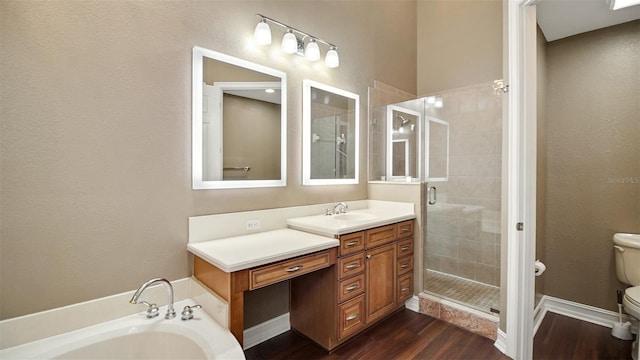 full bathroom with hardwood / wood-style flooring, vanity, toilet, and shower with separate bathtub