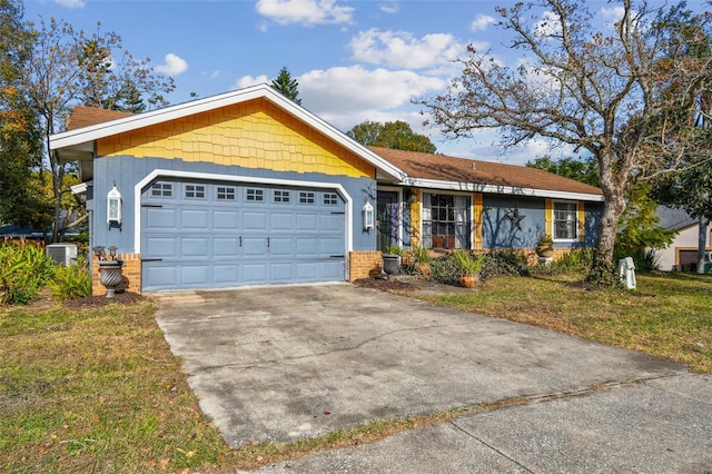 ranch-style house with central AC, a garage, and a front lawn