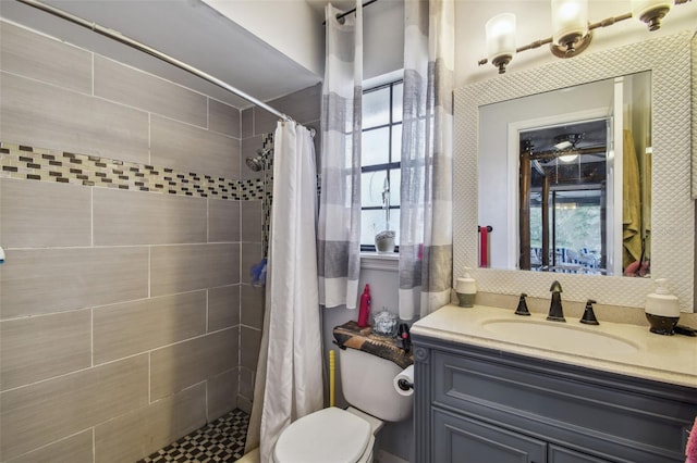 bathroom featuring a shower with curtain, vanity, and toilet