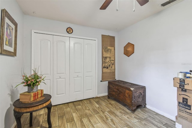 interior space with light hardwood / wood-style flooring and ceiling fan