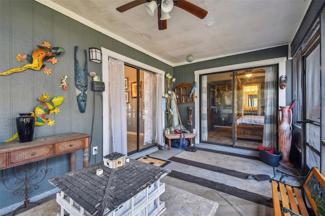 doorway to property featuring ceiling fan