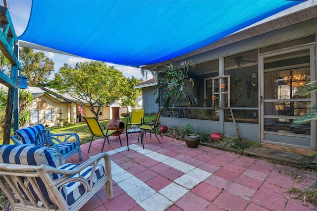 view of patio with a sunroom