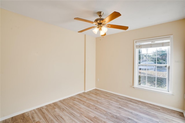 empty room featuring light wood-type flooring and ceiling fan