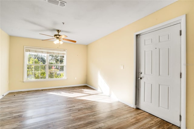 spare room with ceiling fan and light hardwood / wood-style floors