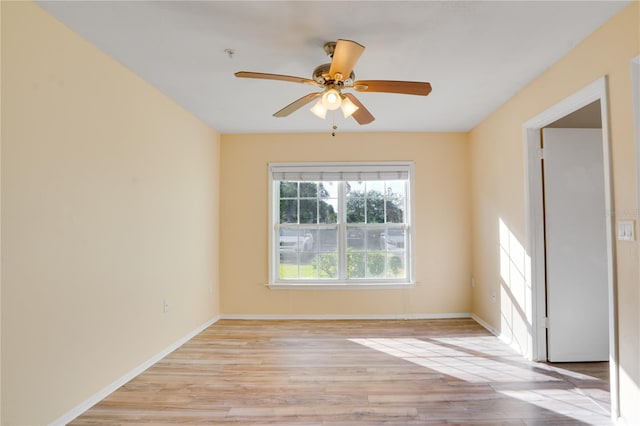 unfurnished room featuring light hardwood / wood-style floors and ceiling fan