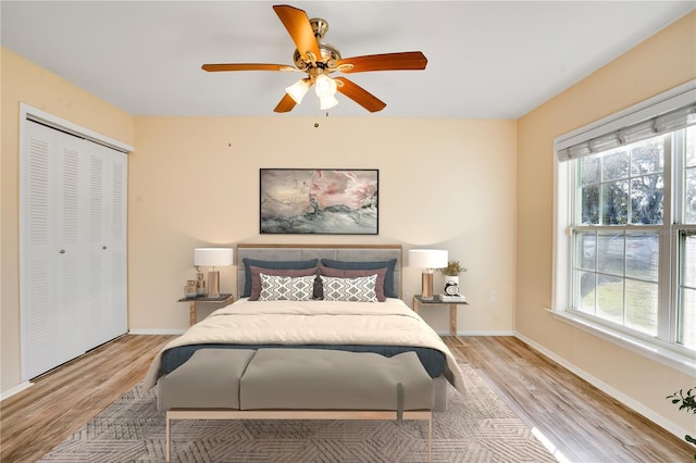 2053 Dixie Belle Dr Unit 2053C, Orlando, FL 32812 - bedroom with multiple windows, light wood-style floors, and ceiling fan