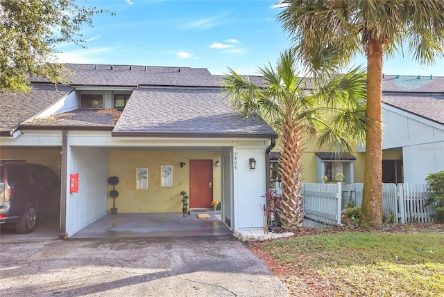 view of front of home with a carport