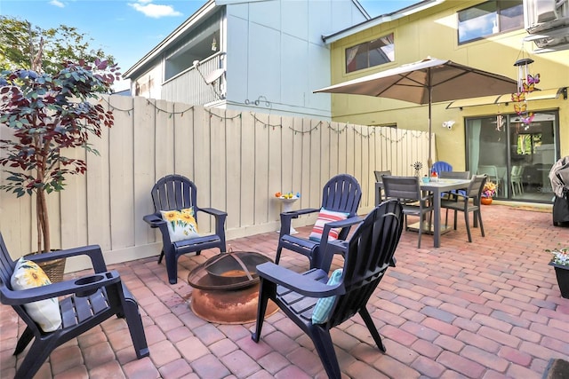 view of patio with an outdoor fire pit