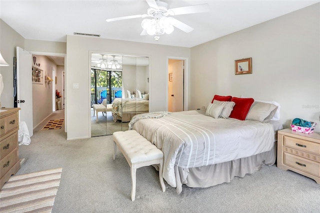 carpeted bedroom featuring a closet and ceiling fan