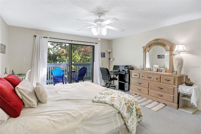 bedroom with access to exterior, a textured ceiling, carpet flooring, and ceiling fan