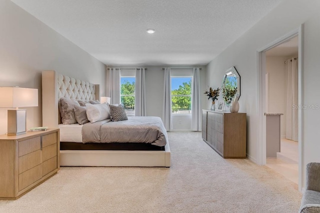 carpeted bedroom with a textured ceiling