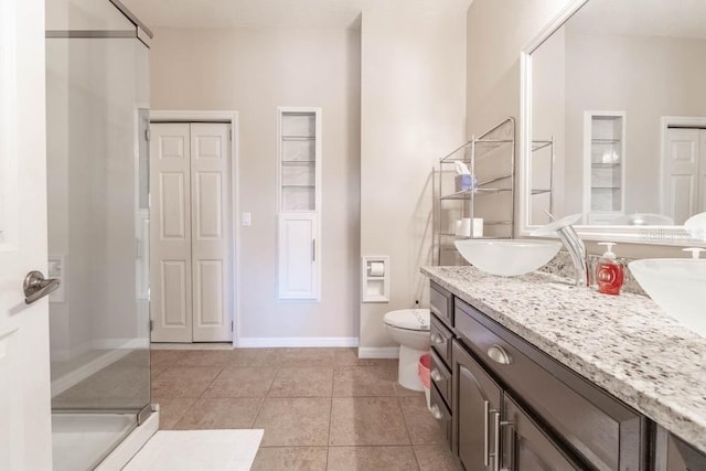 bathroom with toilet, tile patterned floors, an enclosed shower, and vanity