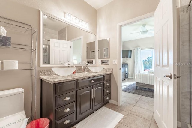 bathroom featuring toilet, ceiling fan, tile patterned floors, and vanity