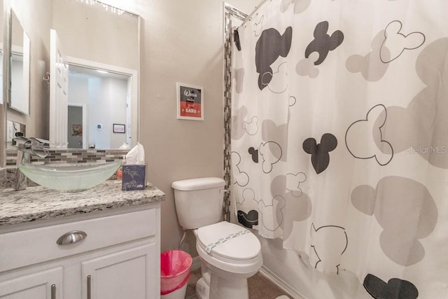 full bathroom with toilet, decorative backsplash, shower / bath combination with curtain, and vanity