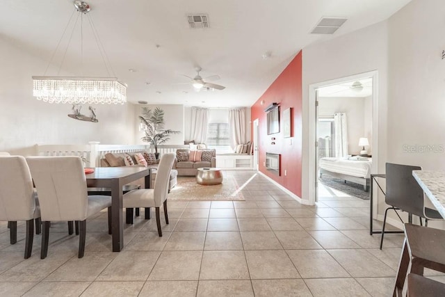 dining space featuring ceiling fan and light tile patterned flooring