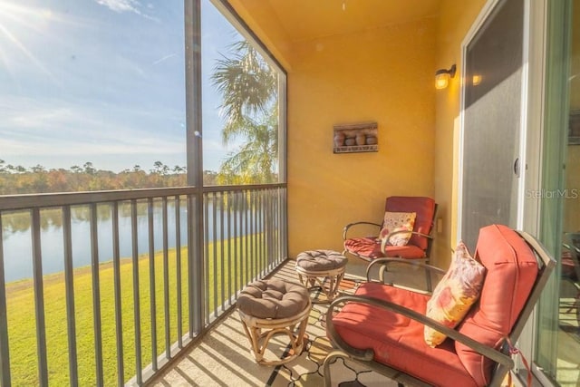 sunroom / solarium with a water view