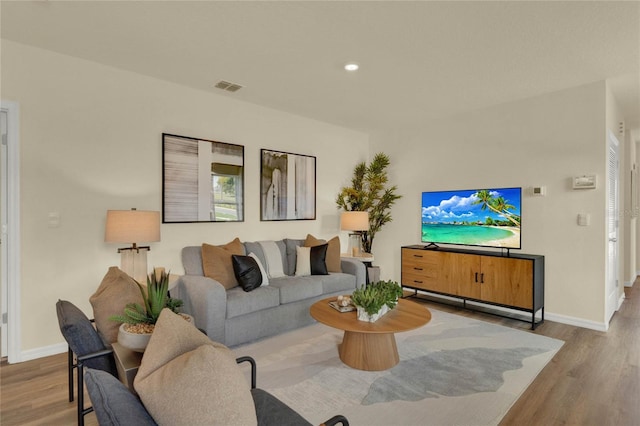 living room with light hardwood / wood-style floors