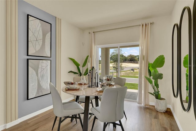 dining room featuring light hardwood / wood-style floors