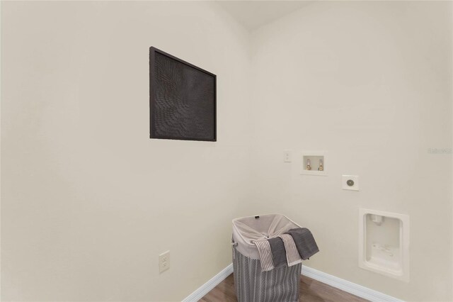 washroom featuring hardwood / wood-style floors, electric dryer hookup, and hookup for a washing machine