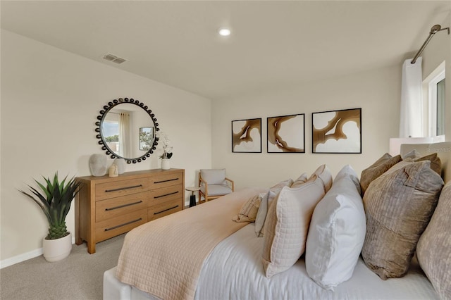 bedroom featuring light carpet