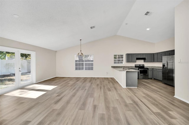 kitchen featuring light stone countertops, french doors, stainless steel appliances, and light hardwood / wood-style flooring